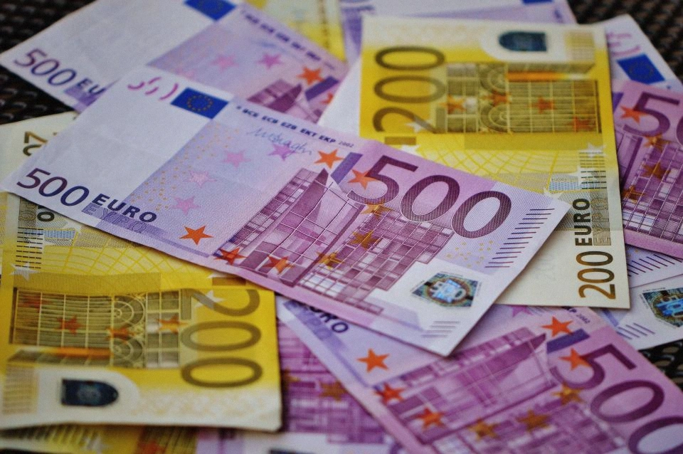 Euro banknotes laid out covering the cash costs of a Santorini boat tour, Greece